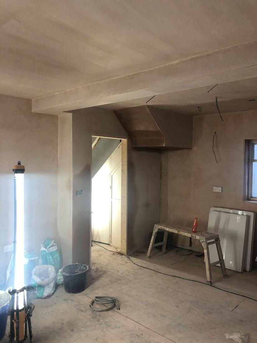 After — Living room — full strip & re-skim