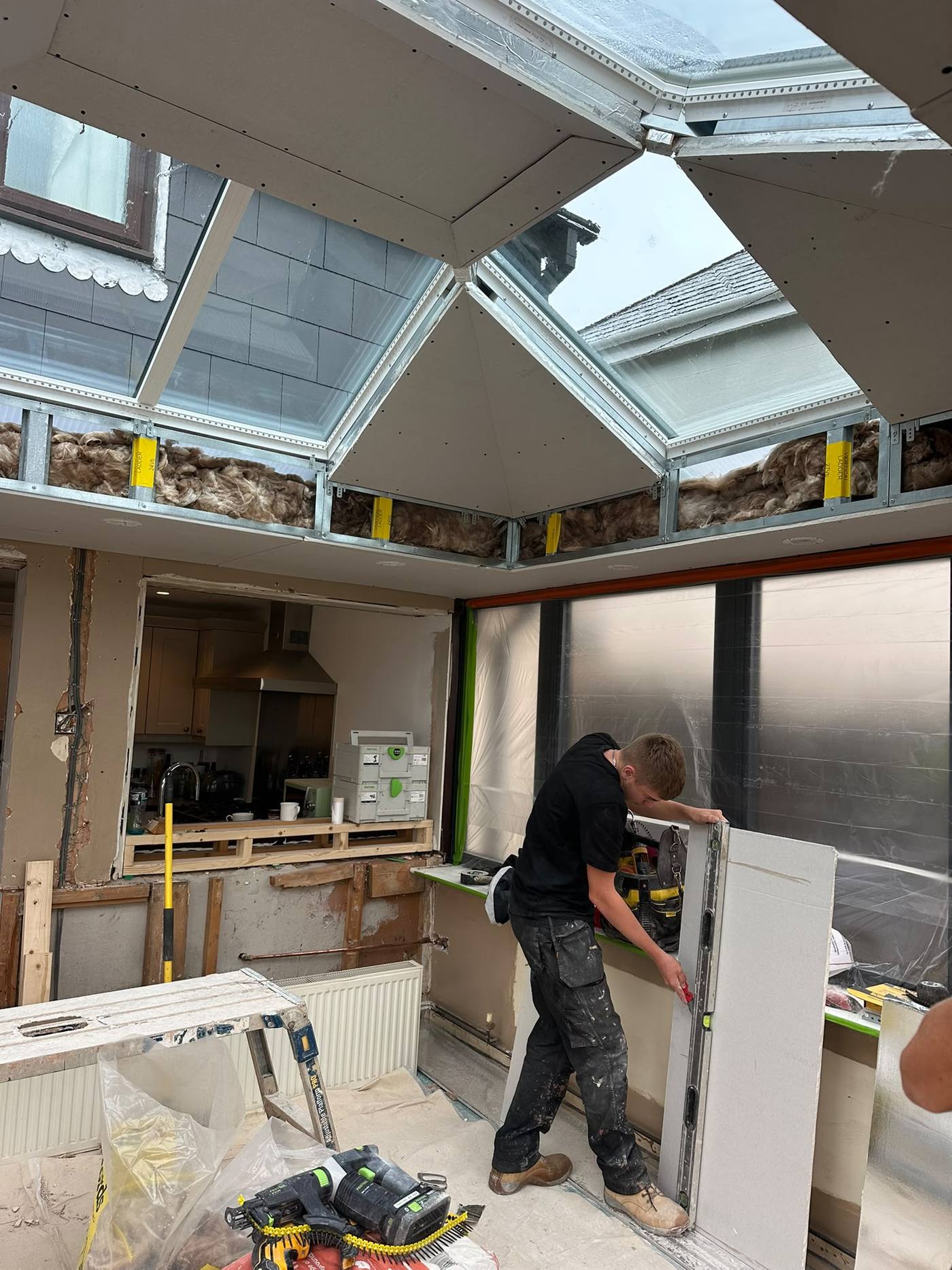 Boarding a conservatory roof in Exeter, cutting plasterboard to the frame