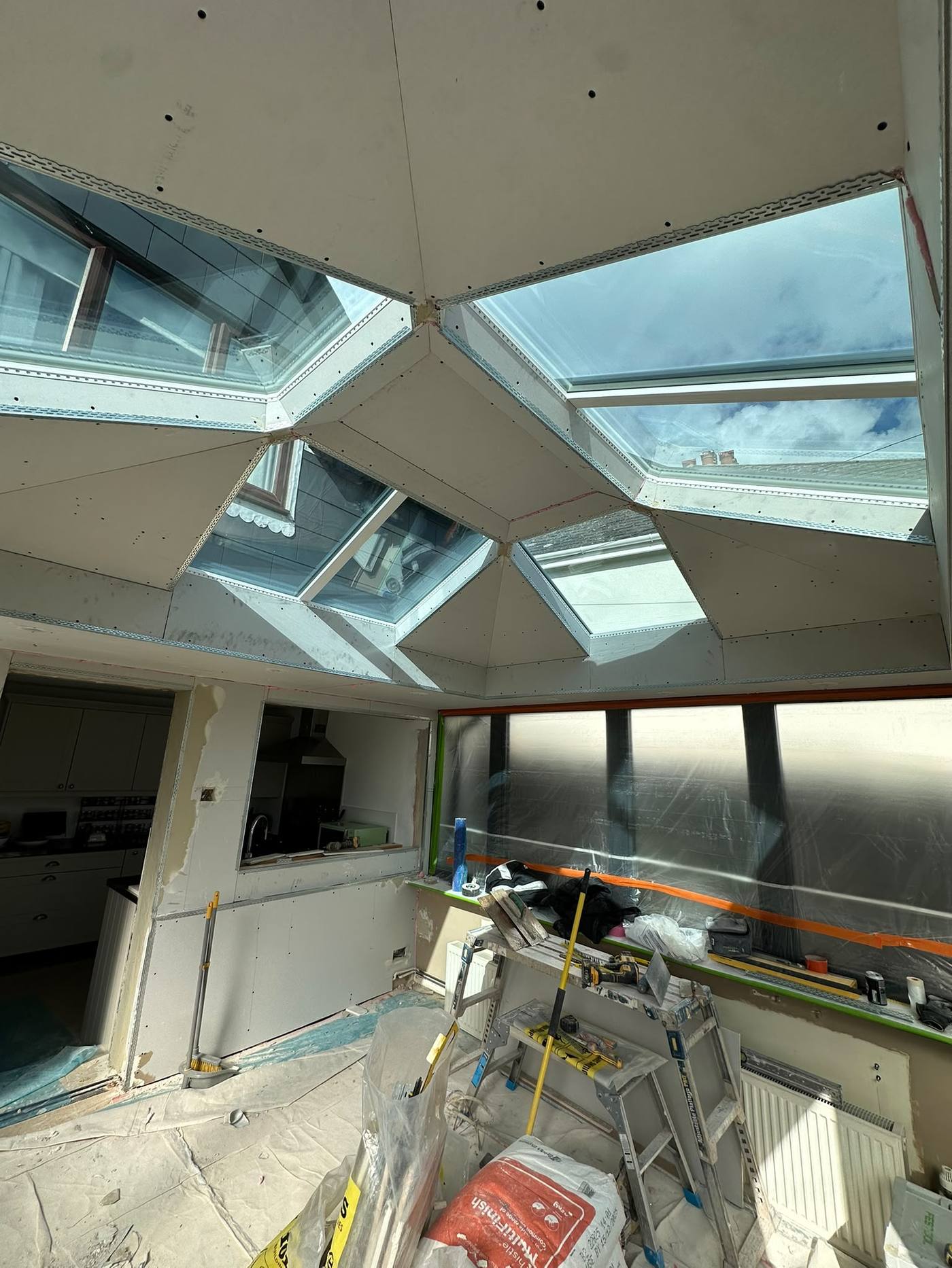 Conservatory roof boarded and skimmed with skylights, finished room