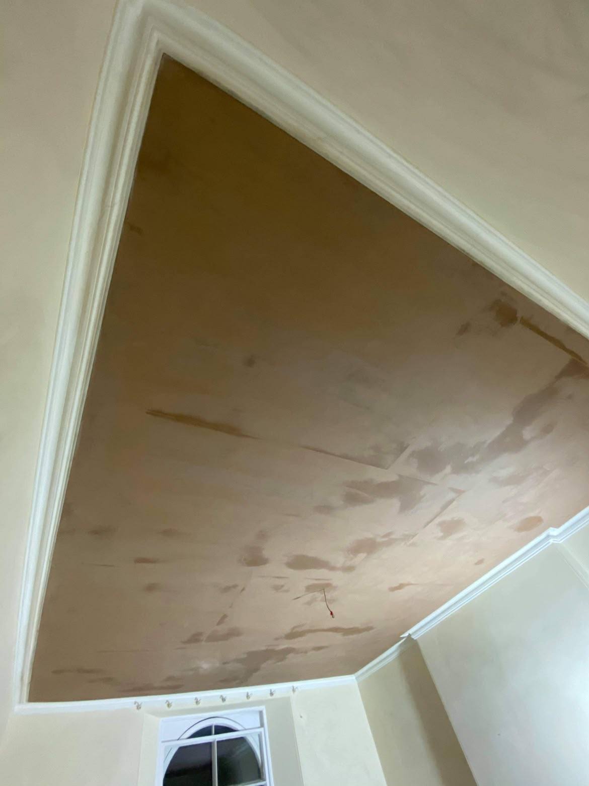 Curved bay ceiling and arched window reveal skimmed smooth