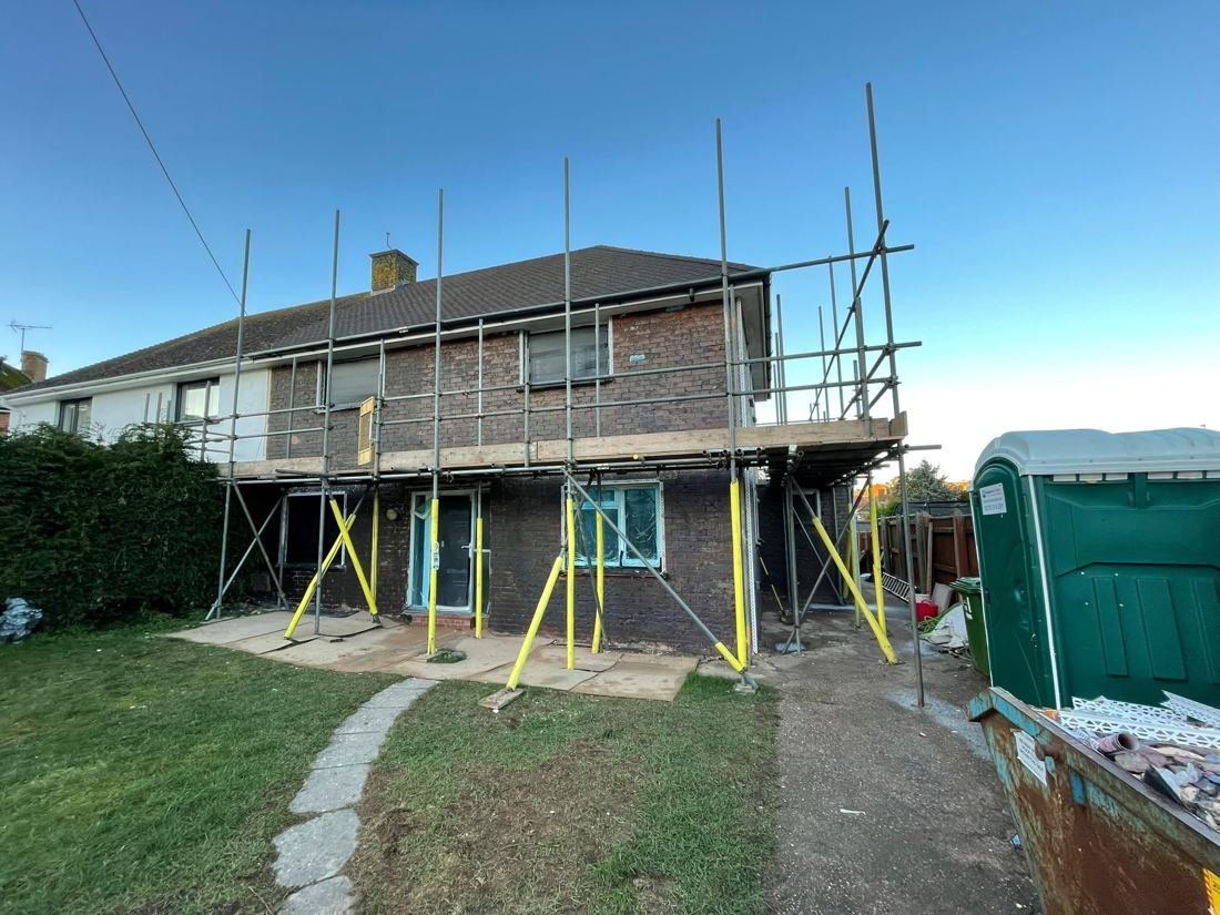 House with tired old render