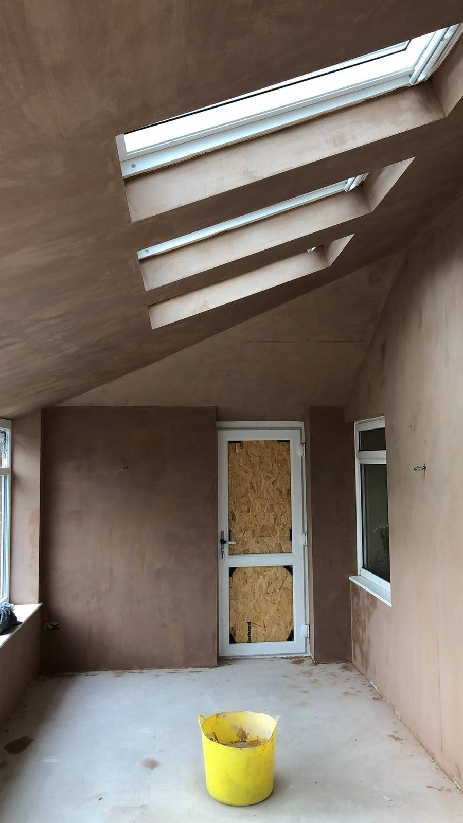 Room with arched window and curved ceiling skimmed, Devon