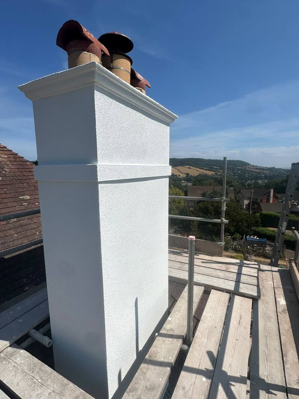 Detached house in Cowley near Exeter re-rendered in white silicone render