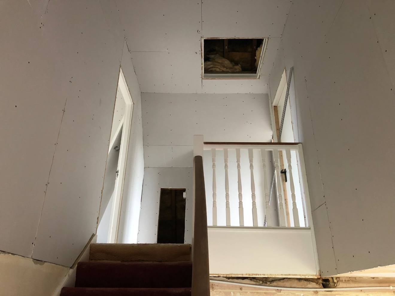 Stairwell walls and ceiling boarded ready for skimming